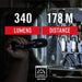 Hand holding a flashlight with lumens and distance information displayed