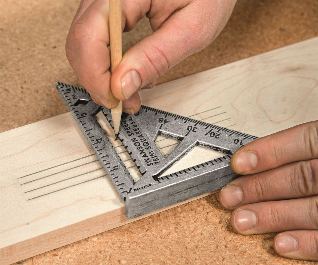 Swanson Speed square on a piece of timber with four pencil lines on it 